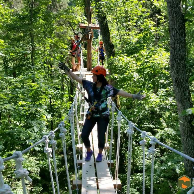 a man standing next to a tree