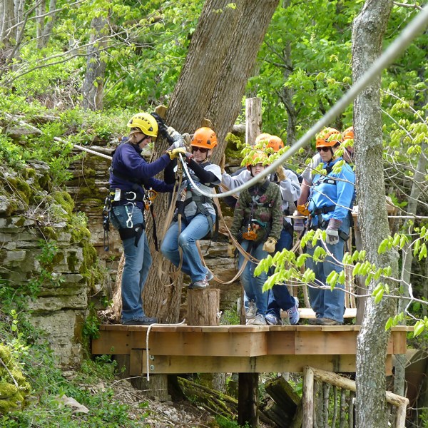 a person standing next to a tree