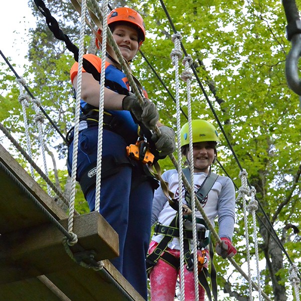 a person standing next to a tree