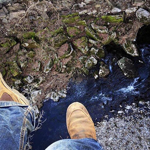 a man sitting on a rock