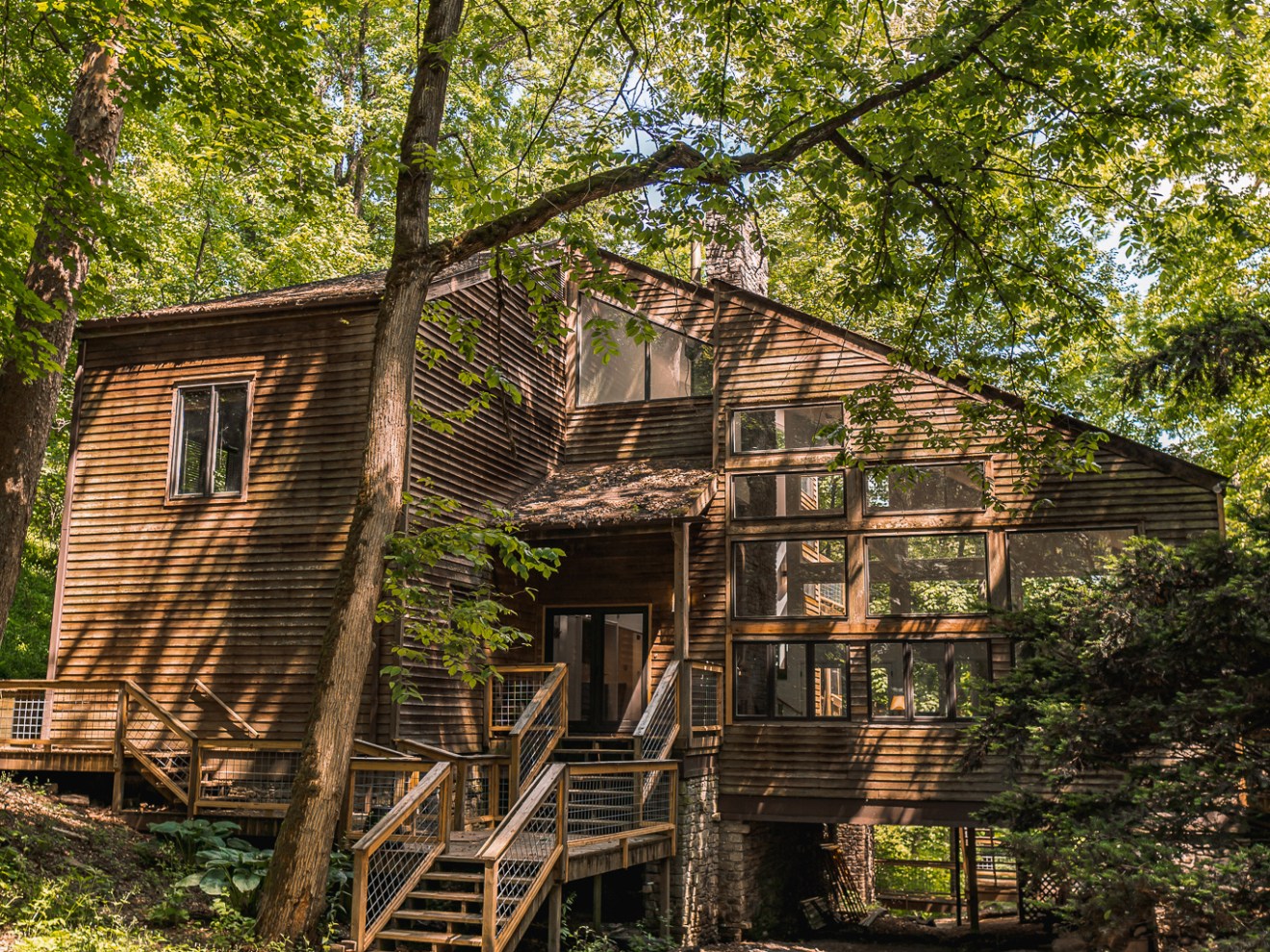 a house with trees in the shade of a tree