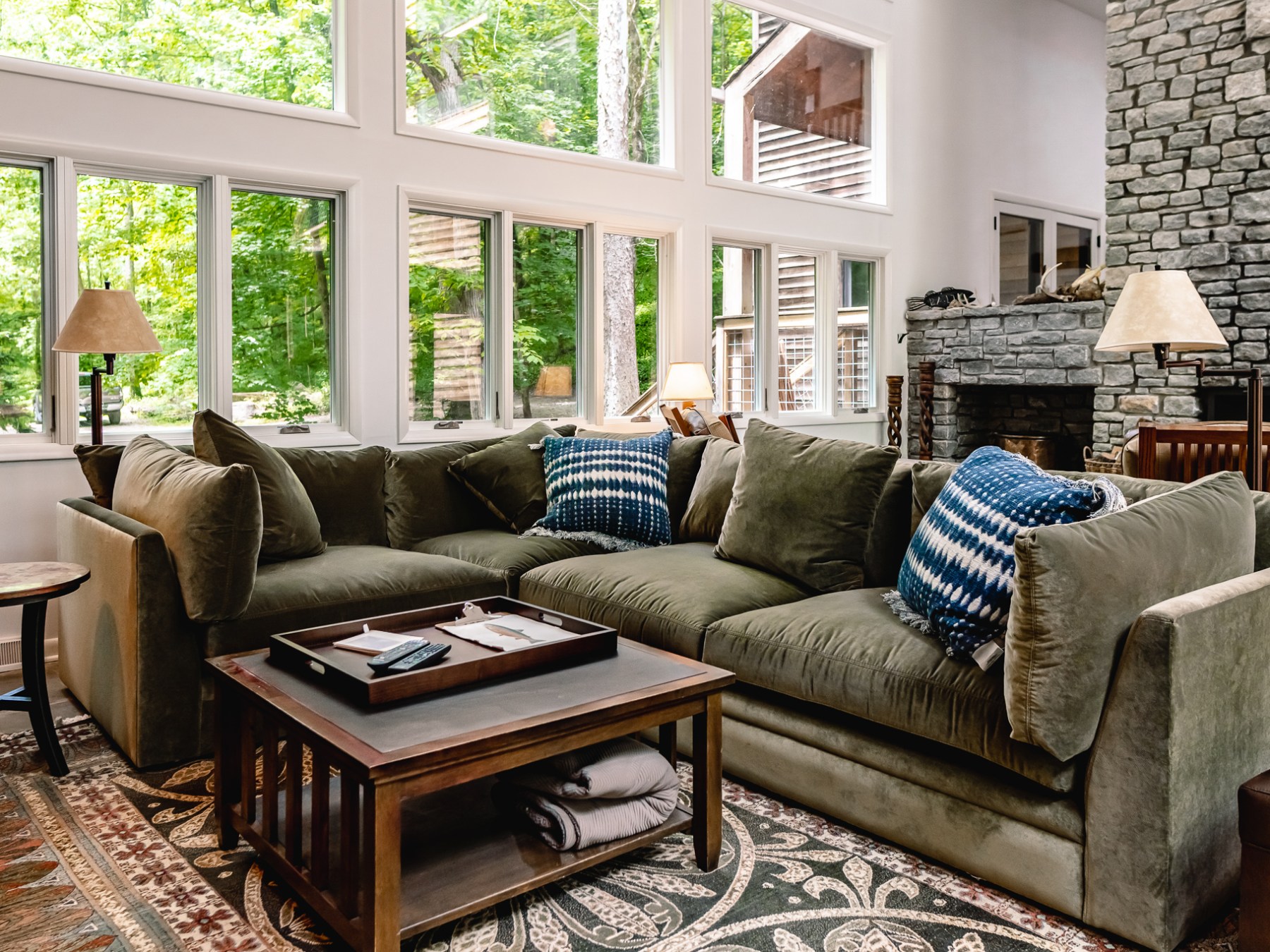 a living room filled with furniture and a large window