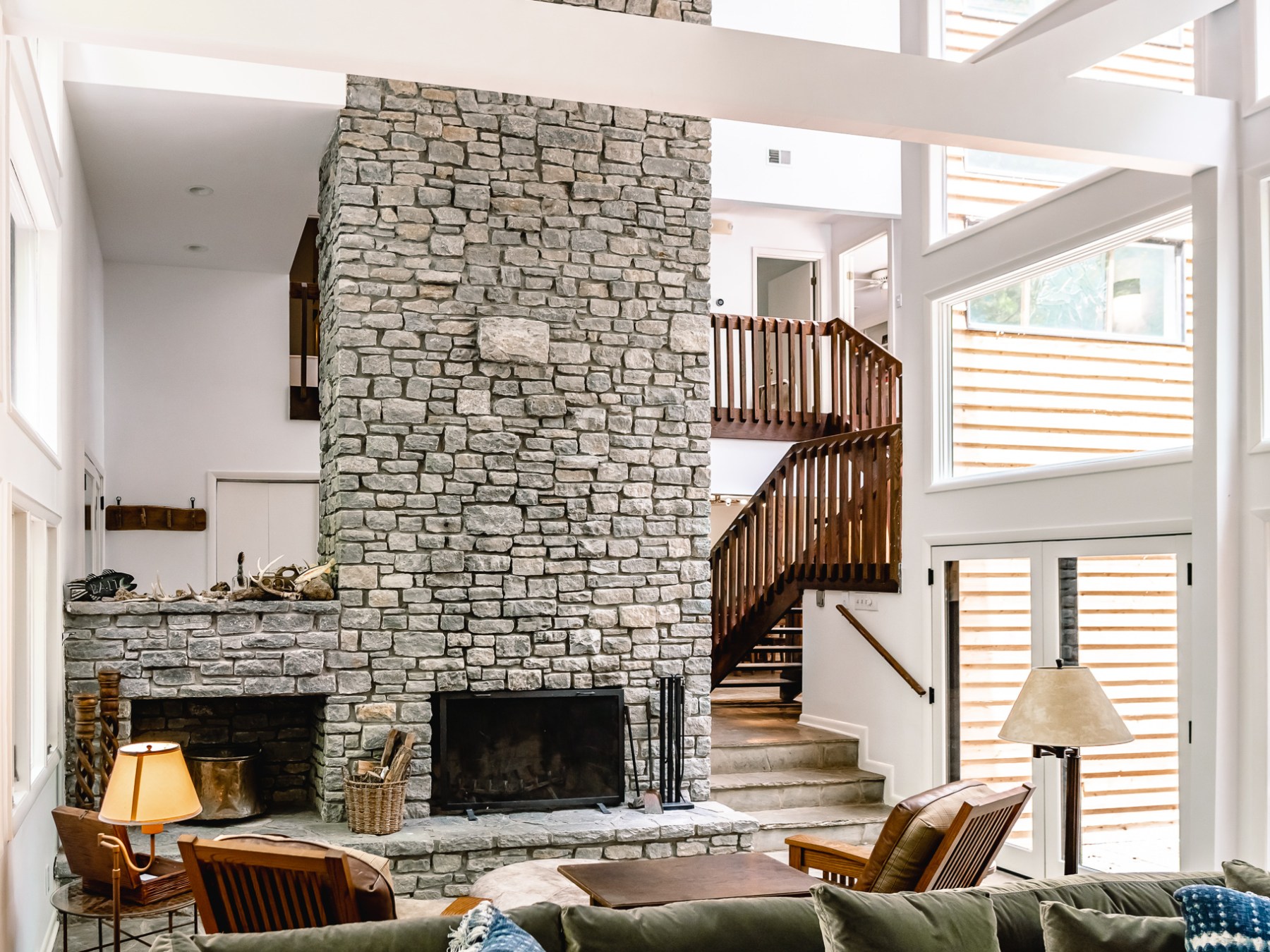 a living room filled with furniture and a fireplace