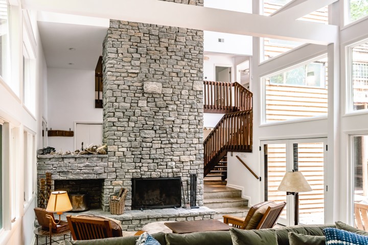 a living room filled with furniture and a fireplace