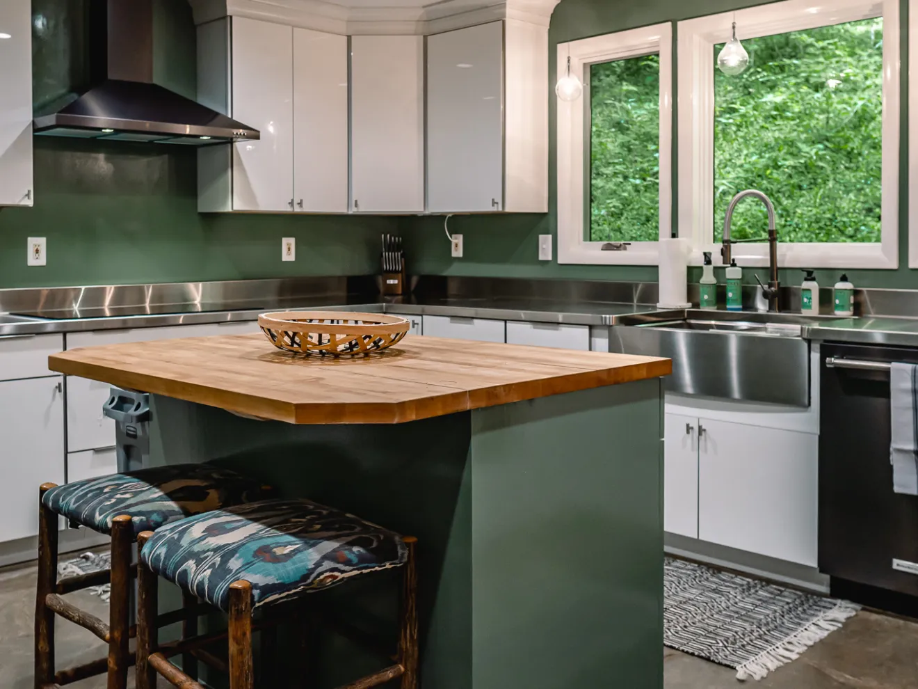 a kitchen with an island in the middle of a room