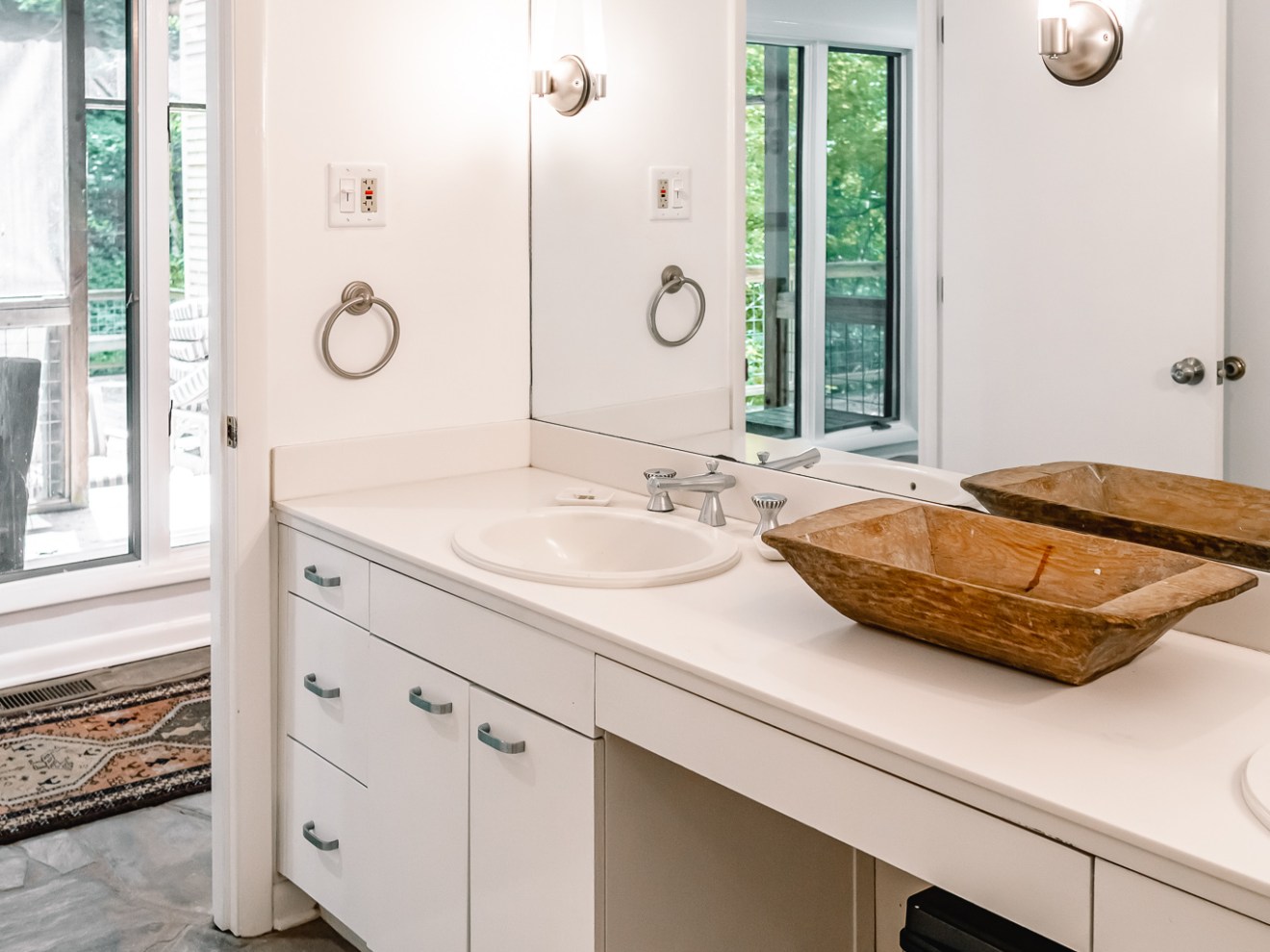 a room with a sink and a mirror