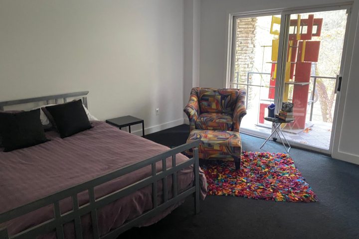 a bedroom with a bed in a room