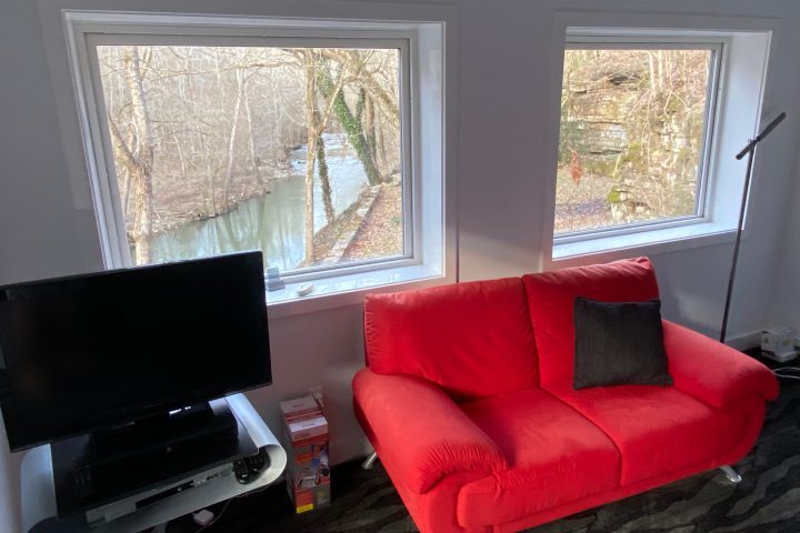a living room next to a window