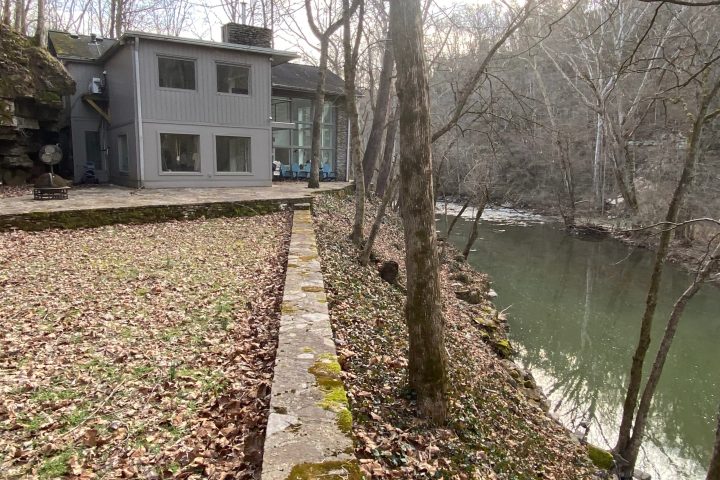 a house with trees in the background