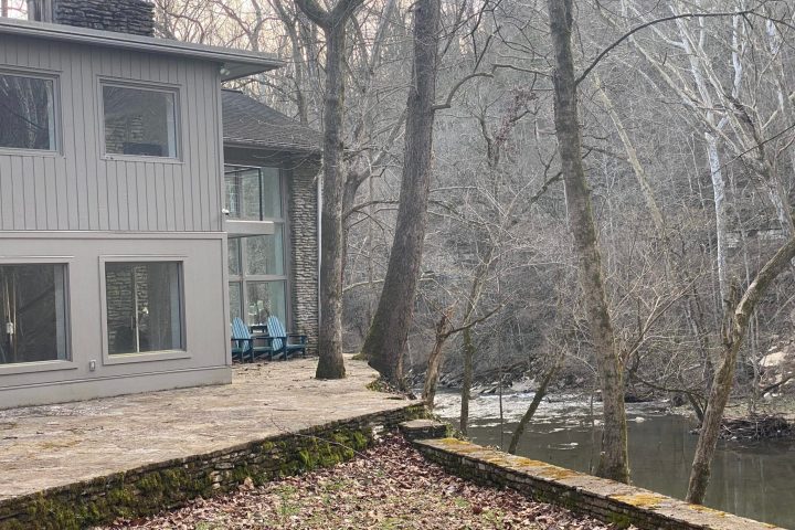 a house with trees in the background