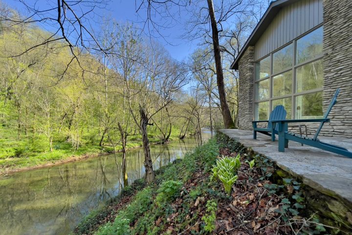 a path with trees on the side of a building