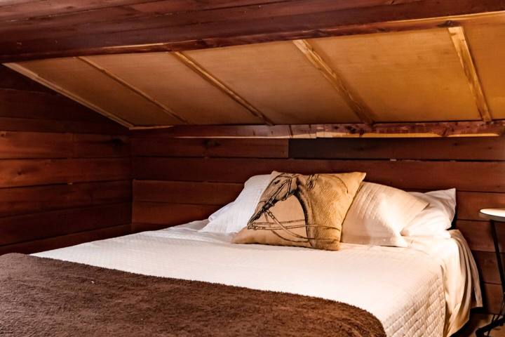 a bedroom with a large bed sitting in a room